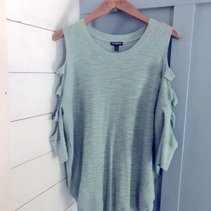 Express quarter length shirt with cuts on sleeves.